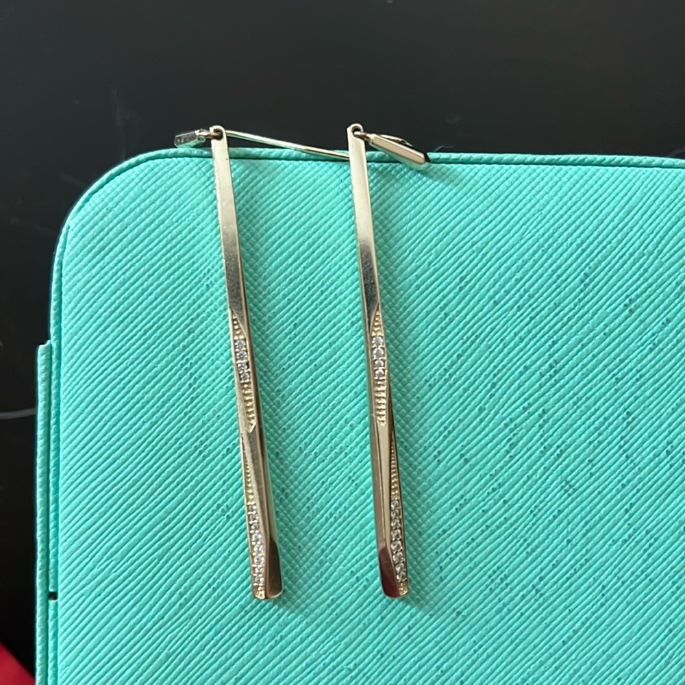 Kendra Scott gold earrings with rhinestones detail